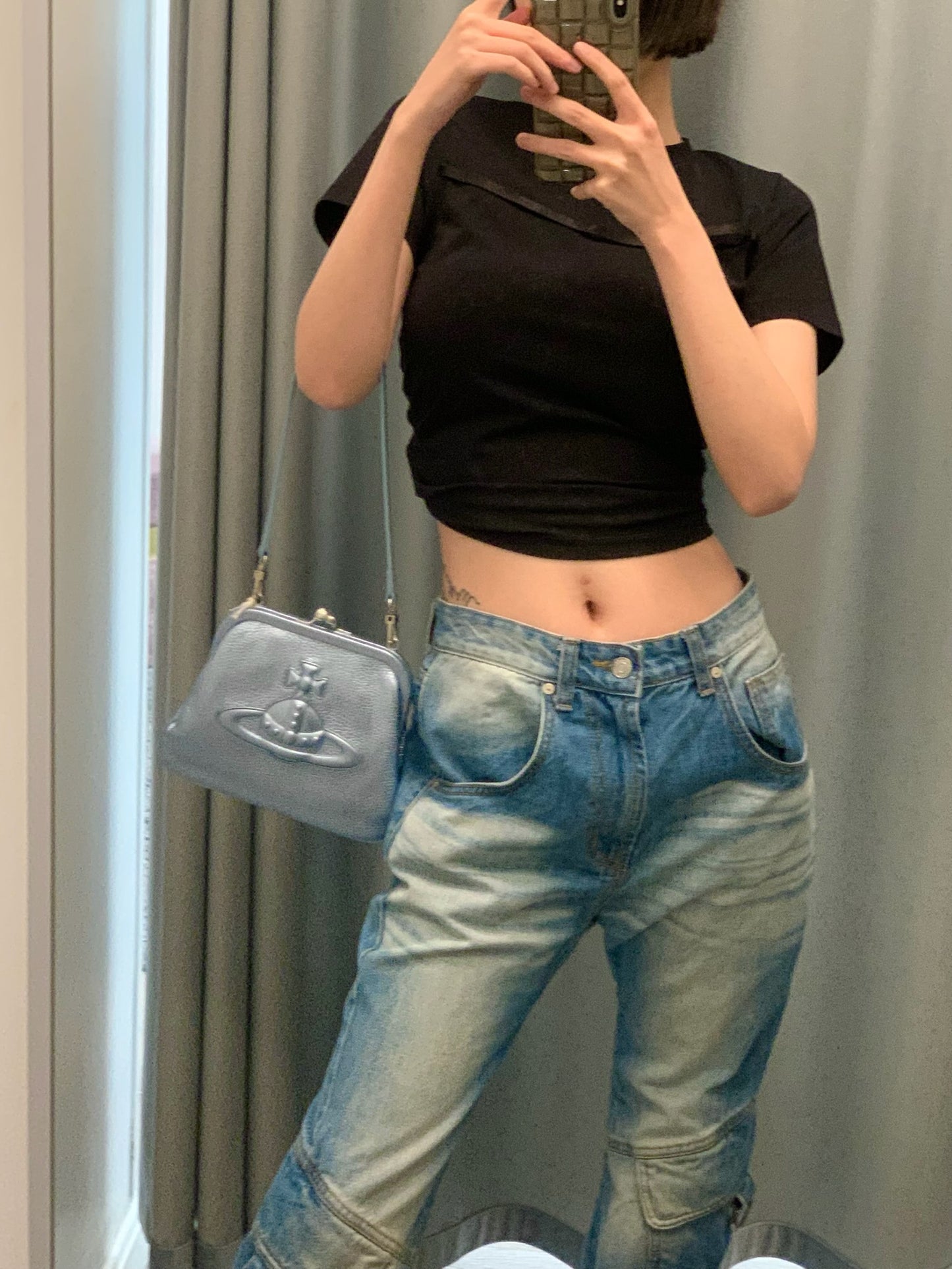 Vivienne Injected Orb leather clutch